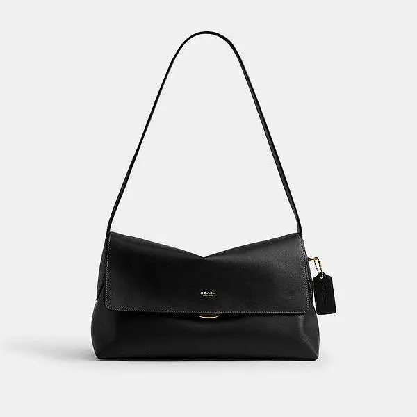 Black Coach Chelsea Shoulder Bag 30 with a flap front and long shoulder strap.
