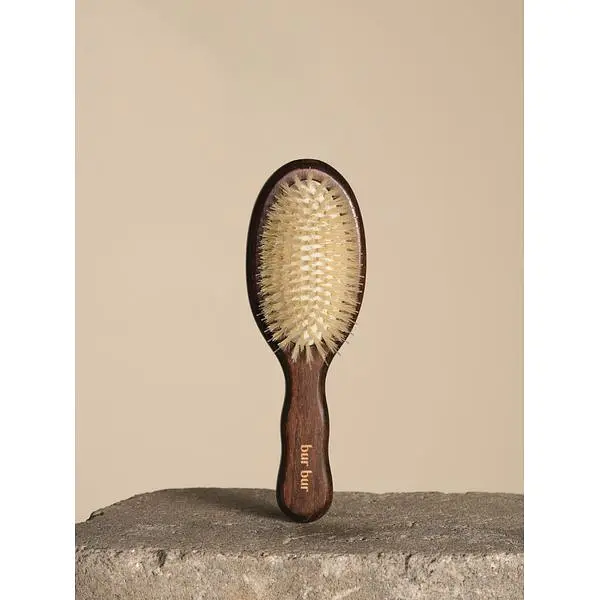 BUR BUR Mermaid Mini brush with light bristles and a short brown handle.