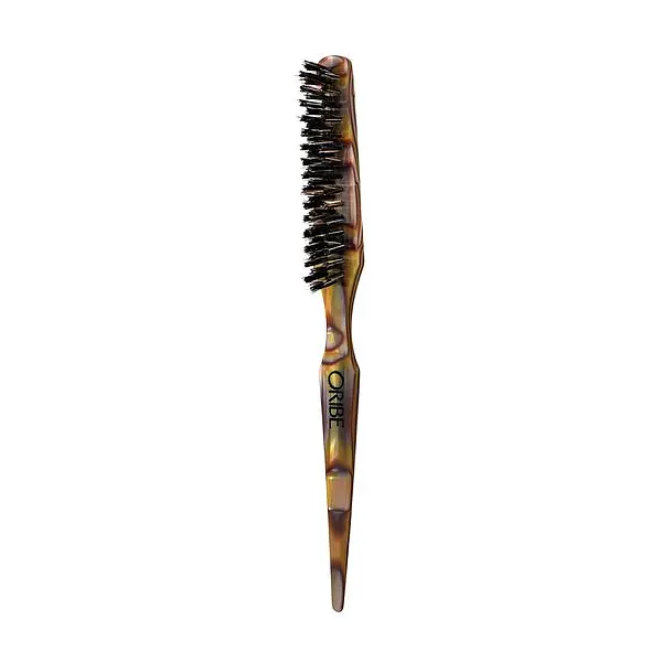 Slim Oribe teasing brush with dark bristles and a pointed tortoiseshell-pattern handle.