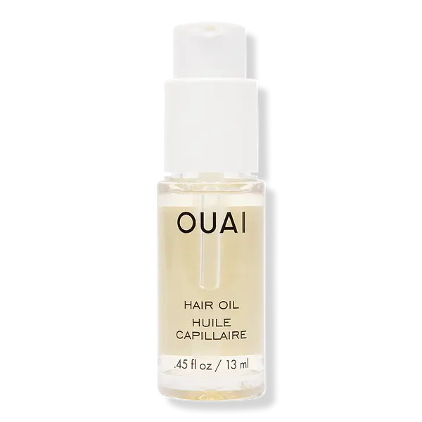 Clear OUAI Hair Oil bottle with a white pump.