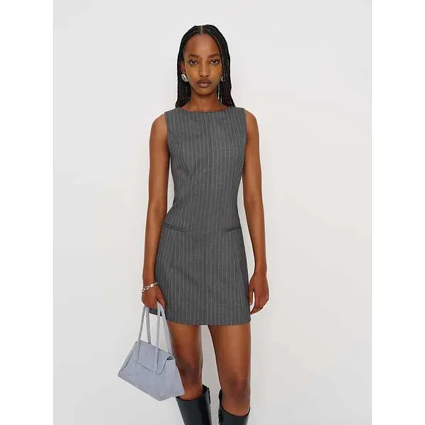 Model wearing the grey pinstripe Reformation Citron mini dress.
