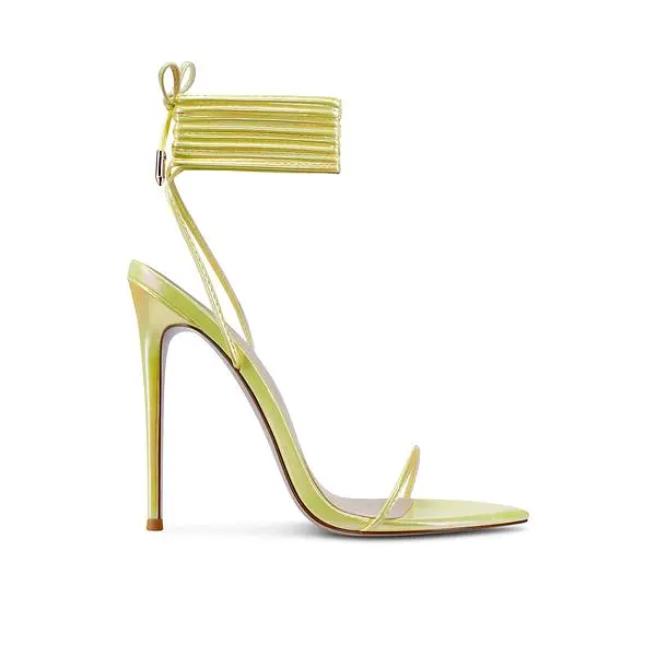 Femme LA Luce Minimale metallic yellow-gold sandal with a high heel and wraparound ankle ties.