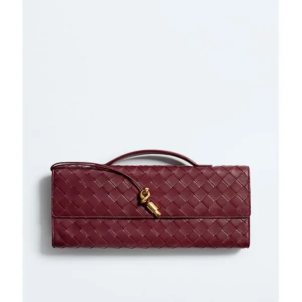 Bottega Veneta Andiamo clutch in burgundy woven leather with a top handle and gold-tone knot.